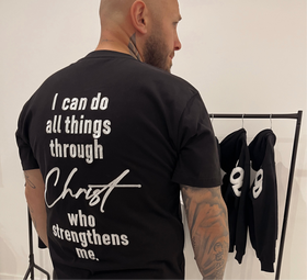 Close-up of the Philippians 4:13 print on the black heavyweight tee | WORDOFGOD Apparel