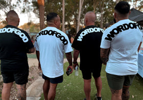 Group of men wearing WORDOFGOD adult tees, back view | WORDOFGOD Apparel
