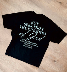 Black Matthew 6:33 Seek the Kingdom oversized tee laid flat, back print | WORDOFGOD Apparel