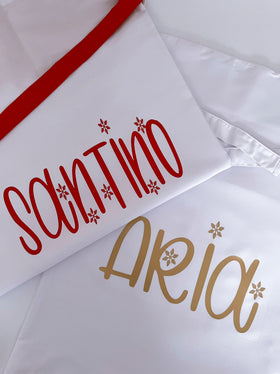 Close-up of custom names on personalised Santa sacks | WORDOFGOD Apparel