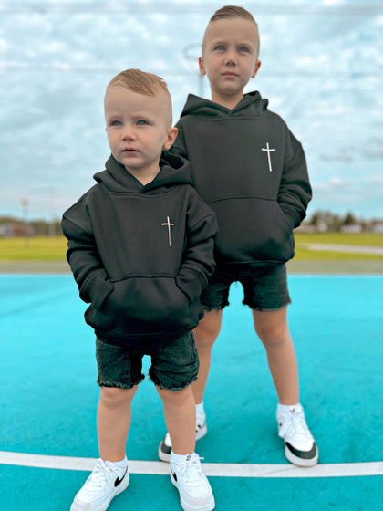 Two boys wearing black Jesus Is King kids hoodies, front view | WORDOFGOD Apparel