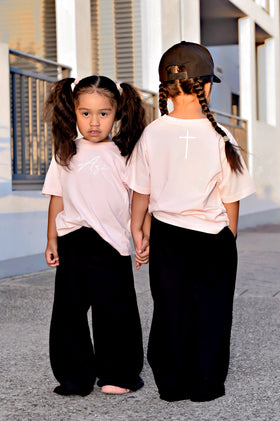 Two girls wearing personalised custom name tees in pink and white | WORDOFGOD Apparel
