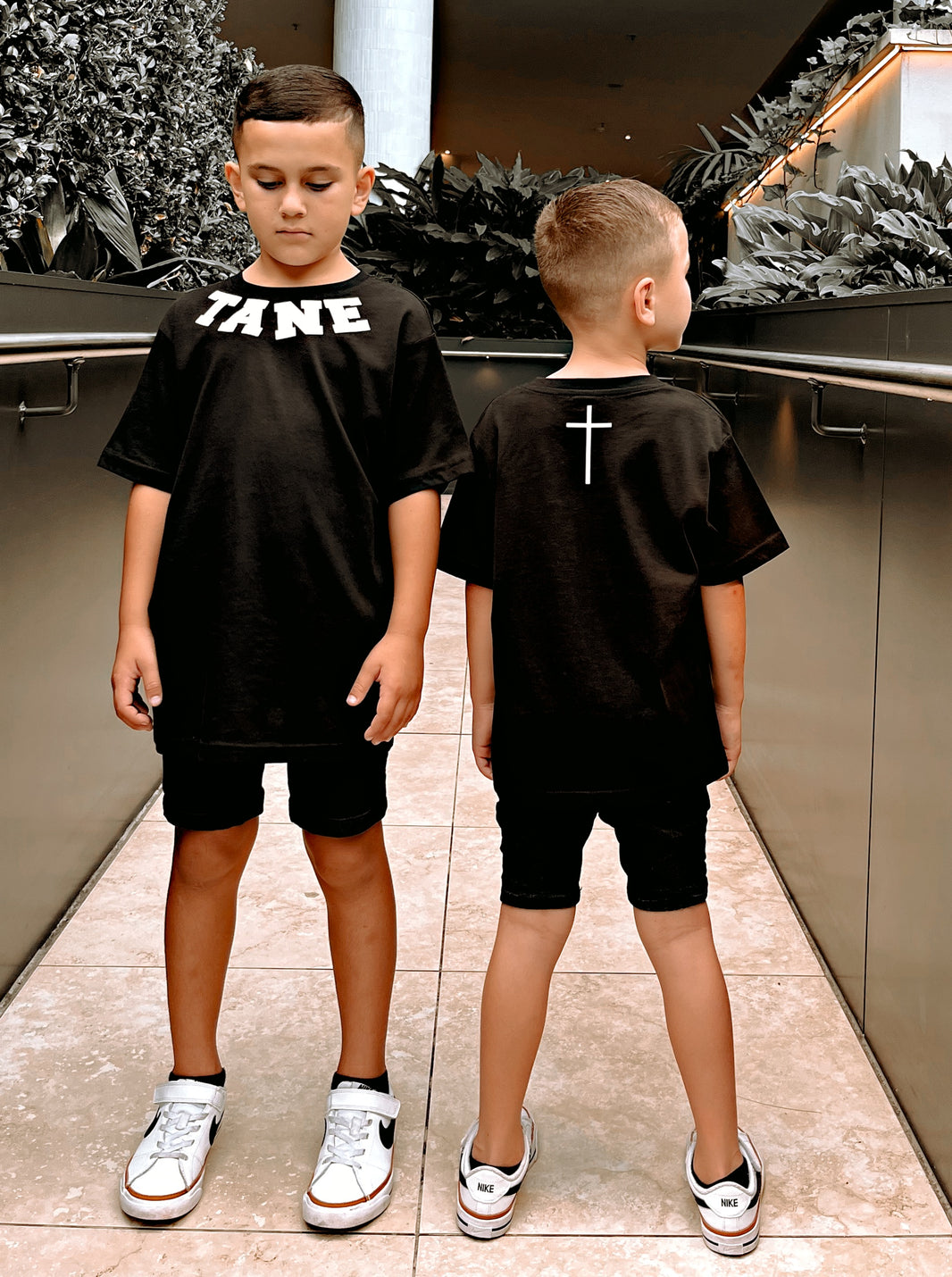 Two boys wearing black custom curved name tees | WORDOFGOD Apparel